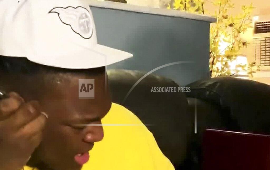Uncredited In this still image from video provided by the NFL, Isaiah Wilson reacts after being chosen by the Tennessee Titans during the NFL football draft Thursday, April 23, 2020. (NFL via AP)