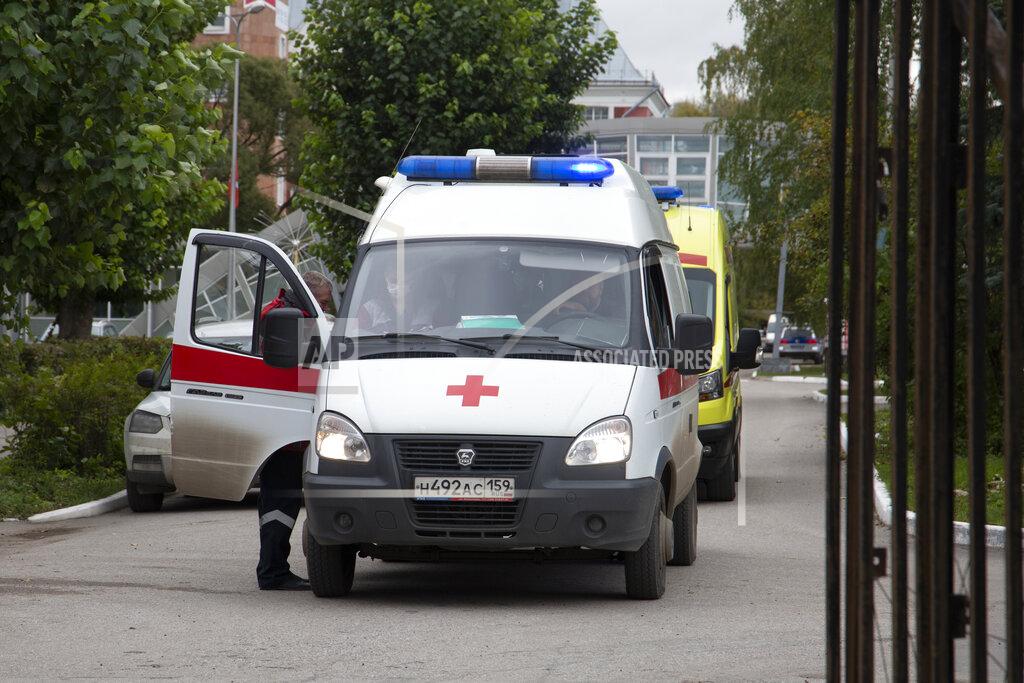 Anastasia Yakovleva Ambulances parked at the Perm State University in Perm, about 1,100 kilometers (700 miles) east of Moscow, Russia, Monday, Sept. 20, 2021. A gunman opened fire in a university in the Russian city of Perm on Monday morning, leaving at least eight people dead and others wounded, according to Russia's Investigative Committee. (AP Photo/Anastasia Yakovleva)