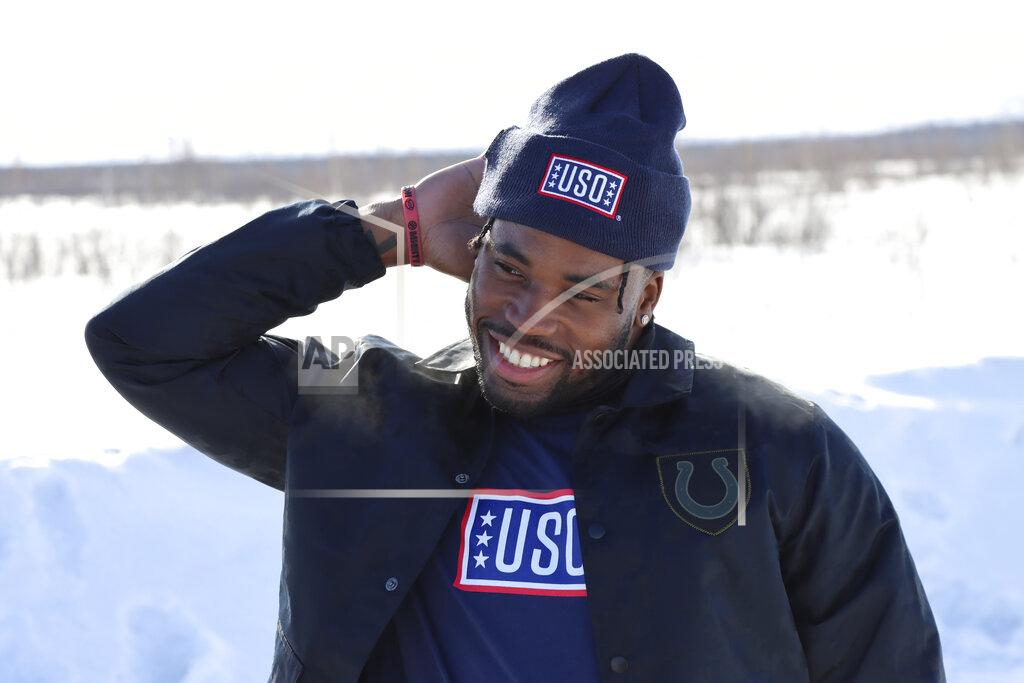 Uncredited In a photo provided by the NFL, Indianapolis Colts' Kenny Moore smiles near Fairbanks, Alaska, April 5, 2022, during the 2022 NFL-USO Tour. Moore was awestruck by the conditions military members must battle. And by their resolve and resourcefulness — things any pro athlete can identify with. (NFL via AP)