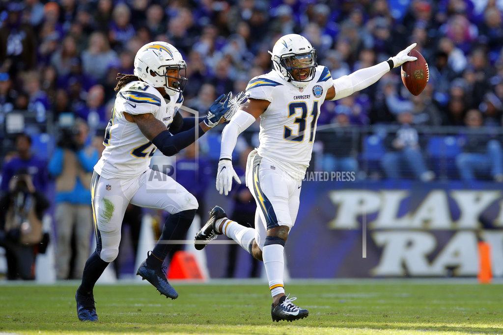 Carolyn Kaster Los Angeles Chargers defensive back Adrian Phillips, right, celebrates with teammate Rayshawn Jenkins after intercepting a pass in the first half of an NFL wild card playoff football game against the Baltimore Ravens, Sunday, Jan. 6, 2019, in Baltimore. (AP Photo/Carolyn Kaster)