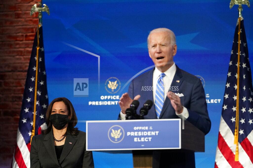 Matt Slocum President-elect Joe Biden speaks about the COVID-19 pandemic during an event at The Queen theater, Thursday, Jan. 14, 2021, in Wilmington, Del., as Vice President-elect Kamala Harris listens. (AP Photo/Matt Slocum)