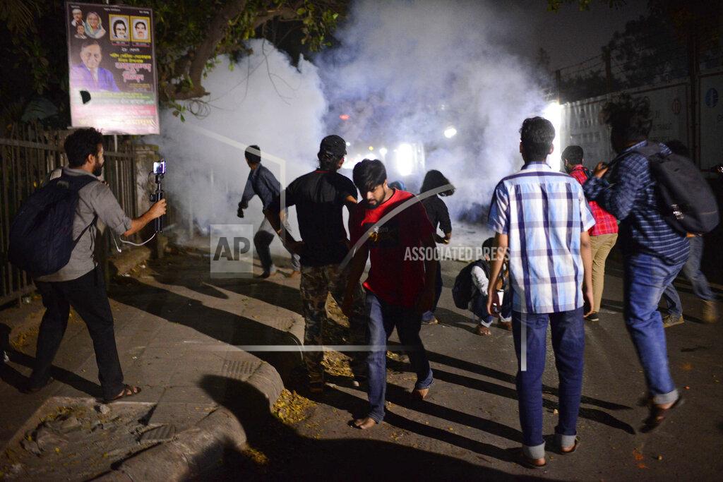 Mahmud Hossain Opu Police use tear gas shells on demonstrators protesting the death in prison of a writer who was arrested on charges of violating the sweeping digital security, in Dhaka, Bangladesh, Friday, Feb. 26, 2021. Mushtaq Ahmed, 53, was arrested in Dhaka in May last year for making comments on social media that criticized the Prime Minister Sheikh Hasina government's handling of the coronavirus pandemic. He had been denied bail at least six times. (AP Photo/Mahmud Hossain Opu)