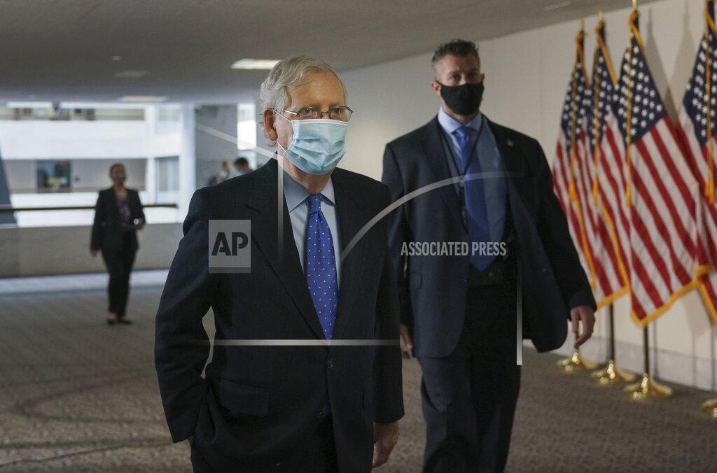 J. Scott Applewhite Senate Majority Leader Mitch McConnell, R-Ky., arrives for a closed-door meeting with Senate Republicans, on Capitol Hill in Washington, Friday, Oct. 23, 2020. McConnell says there’s nothing the public needs to know about his health after photos showed what appears to be bruising on his hands and around his mouth. (AP Photo/J. Scott Applewhite)