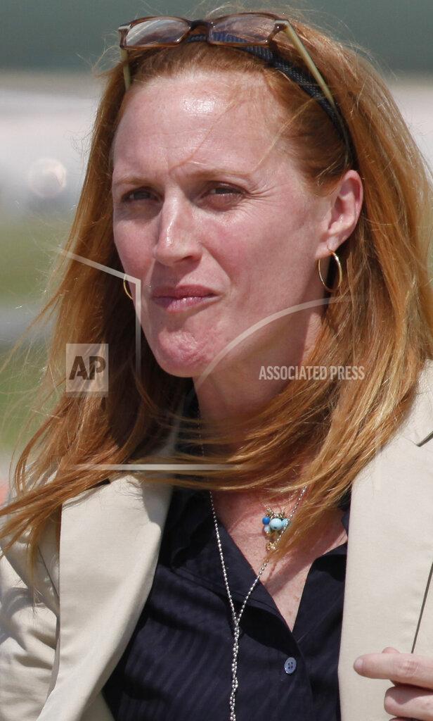 Charles Dharapak FILE - In this June 2, 2010, file photo Louisa Terrell, a member of the White House legislative affairs team, is seen at Andrews Air Force Base, Md. While President Joe Biden pitches his infrastructure plan to the American public, the real work of delivering his legislative agenda takes place behind the scenes. Biden’s 15-person legislative, led by Terrell, is charged with maneuvering and mapping out the process of actually getting his agenda passed on Capitol Hill.(AP Photo/Charles Dharapak, File)