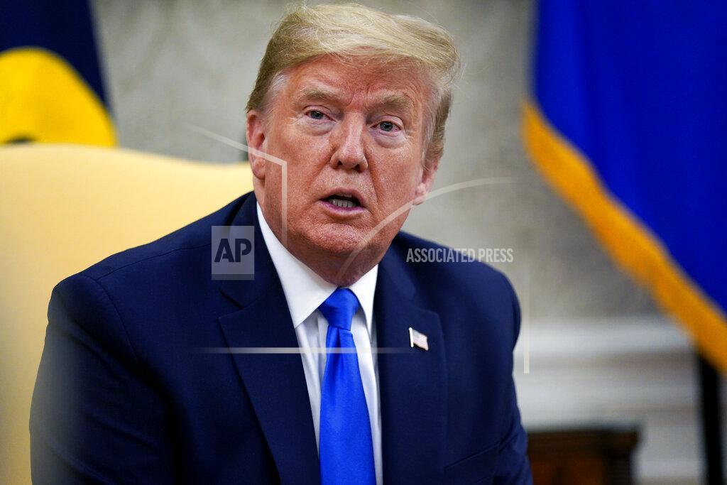 Evan Vucci President Donald Trump speaks during a meeting with Gov. Kim Reynolds, R-Iowa, in the Oval Office of the White House, Wednesday, May 6, 2020, in Washington. (AP Photo/Evan Vucci)