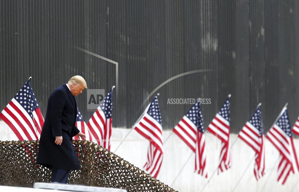 President Donald Trump walks down the steps before a speech near a section of the U.S.-Mexico border wall, Tuesday, Jan. 12, 2021, in Alamo, Texas. (Delcia Lopez/The Monitor via AP)