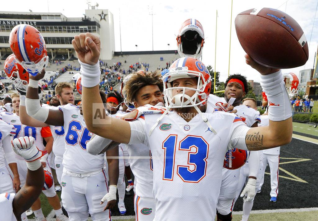 Mark Humphrey Florida quarterback Feleipe Franks (13) celebrates after the Gators defeated Vanderbilt 37-27 in an NCAA college football game Saturday, Oct. 13, 2018, in Nashville, Tenn. (AP Photo/Mark Humphrey)