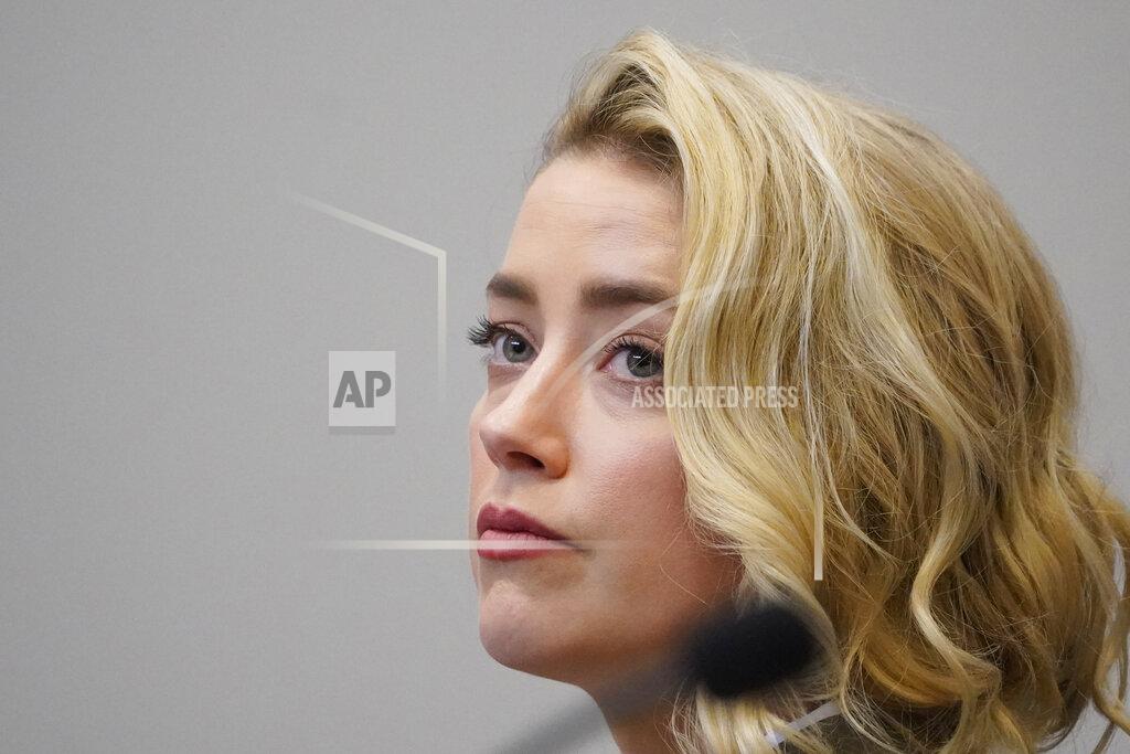 Steve Helber Actor Amber Heard listens in the courtroom at the Fairfax County Circuit Courthouse in Fairfax, Va., Monday, May 23, 2022. Actor Johnny Depp sued his ex-wife Amber Heard for libel in Fairfax County Circuit Court after she wrote an op-ed piece in The Washington Post in 2018 referring to herself as a "public figure representing domestic abuse." (AP Photo/Steve Helber, Pool)