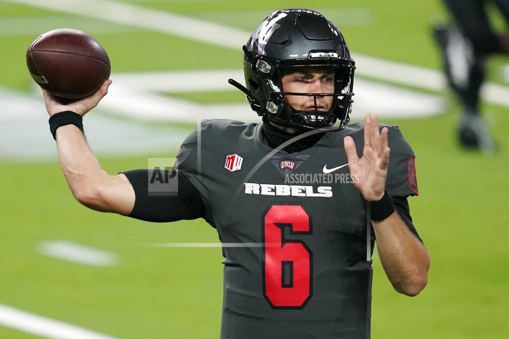 John Locher UNLV quarterback Max Gilliam throws a pass during the first half of the team's NCAA college football game against Nevada on Saturday, Oct. 31, 2020, in Las Vegas. (AP Photo/John Locher)