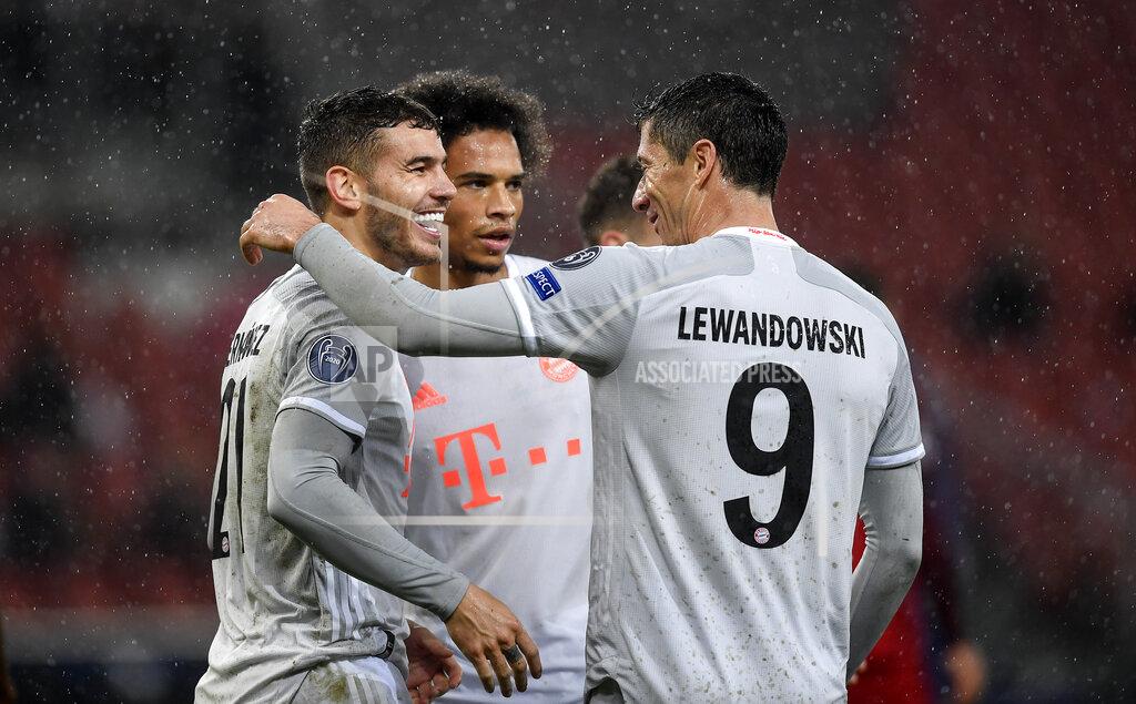 Andreas Schaad Bayern's scorers Lucas Hernandez, Leroy Sane and Robert Lewandowski celebrate their 6th goal by Hernandez during the Champions League group A soccer match between RB Salzburg and Bayern Munich in Salzburg, Austria, Tuesday, Nov. 3, 2020. (AP Photo/Andreas Schaad)