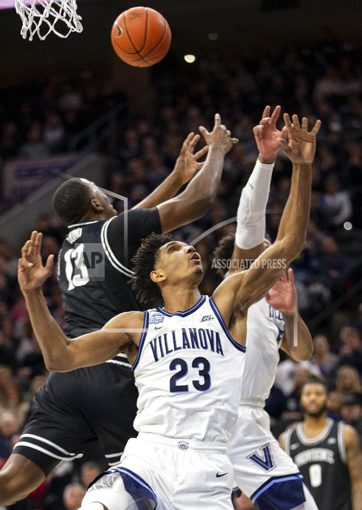 Laurence Kesterson Villanova forward Jermaine Samuels (23) and Providence forward Kalif Young (13) reach for a rebound during the second half of an NCAA college basketball game, Saturday, Feb. 29, 2020, in Philadelphia. Providence won 58-54. (AP Photo/Laurence Kesterson)