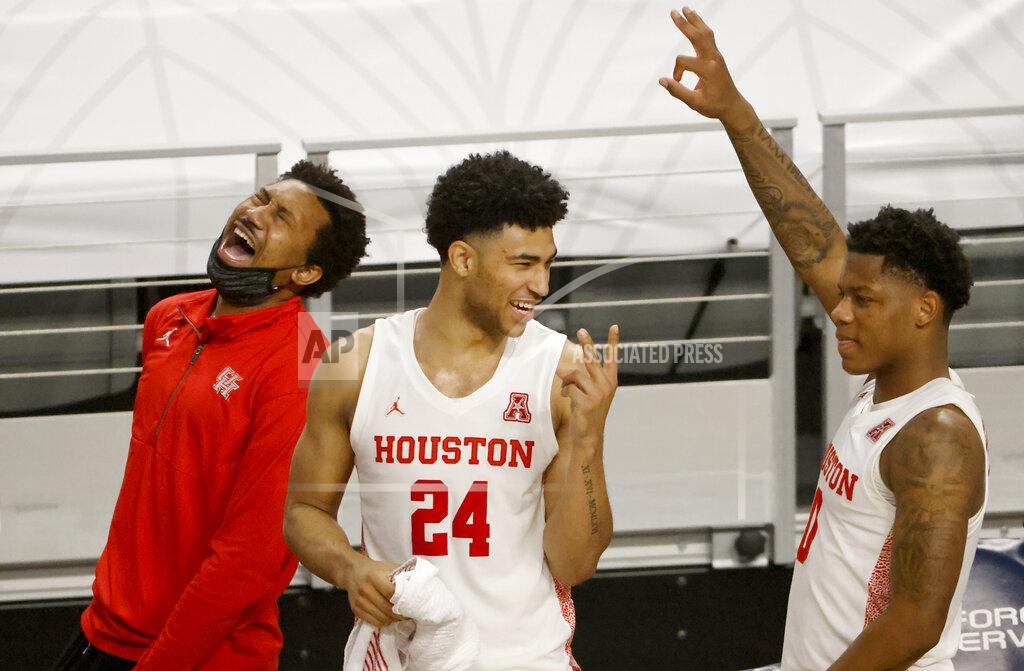 Ron Jenkins Houston guards Quentin Grimes (24) and Marcus Sasser (0) along with the Houston bench react in the final minute against Tulane during the second half of an NCAA college basketball game in the quarterfinal round of the American Athletic Conference men's tournament Friday, March 12, 2021, in Fort Worth, Texas. (AP Photo/Ron Jenkins)