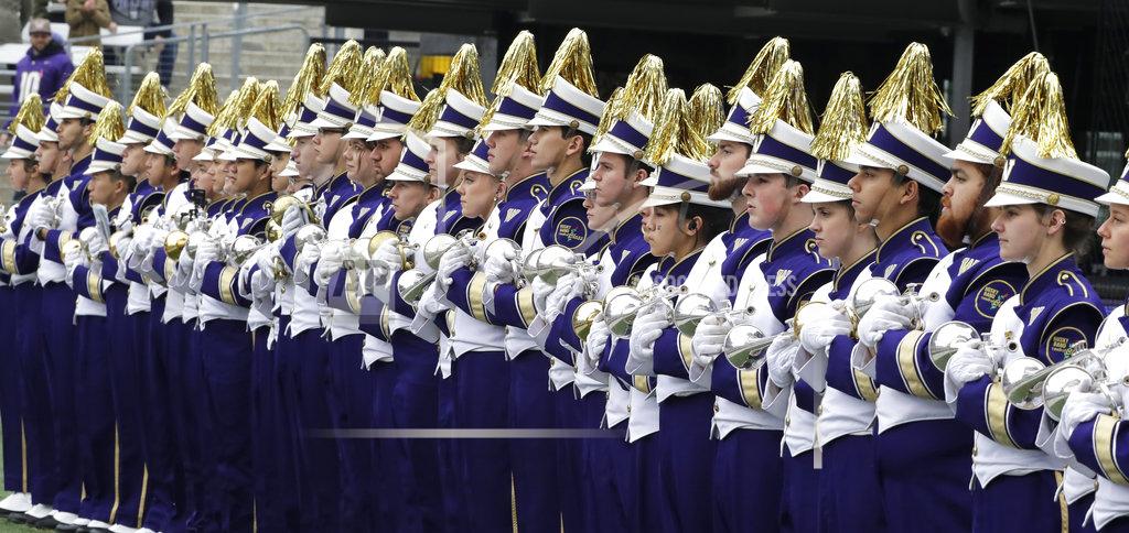 Ted S. Warren Members of the Washington marching band wait to perform before an NCAA college football game against Colorado, Saturday, Oct. 20, 2018, in Seattle. (AP Photo/Ted S. Warren)