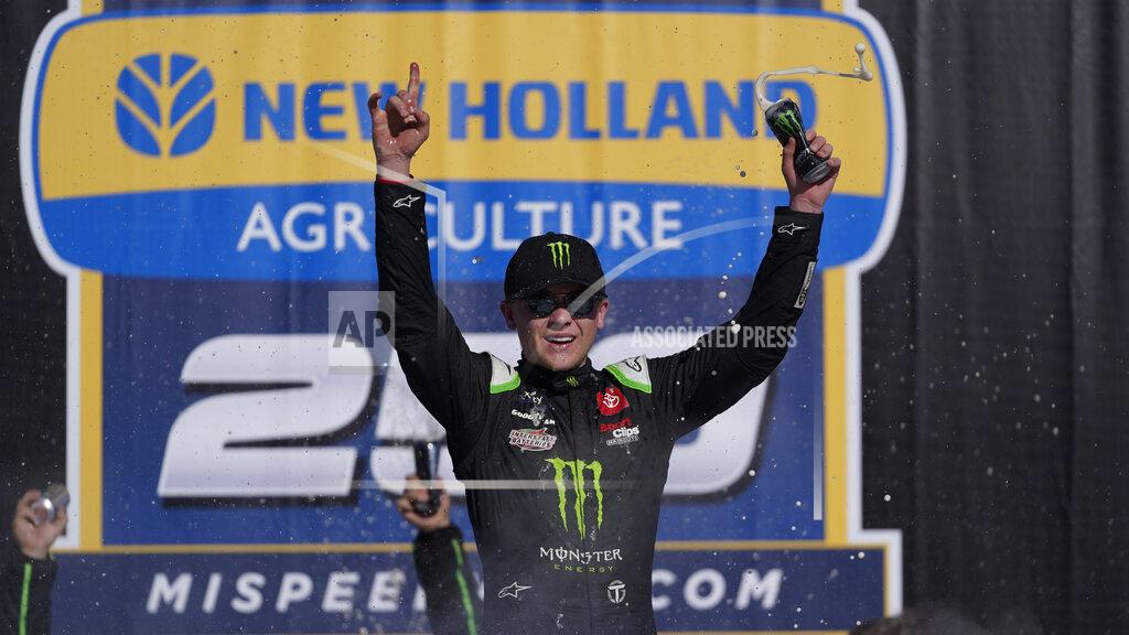 Paul Sancya Ty Gibbs celebrates winning the New Holland 250 NASCAR Xfinity Series auto race at the Michigan International Speedway in Brooklyn, Mich., Saturday, Aug. 6, 2022. (AP Photo/Paul Sancya)