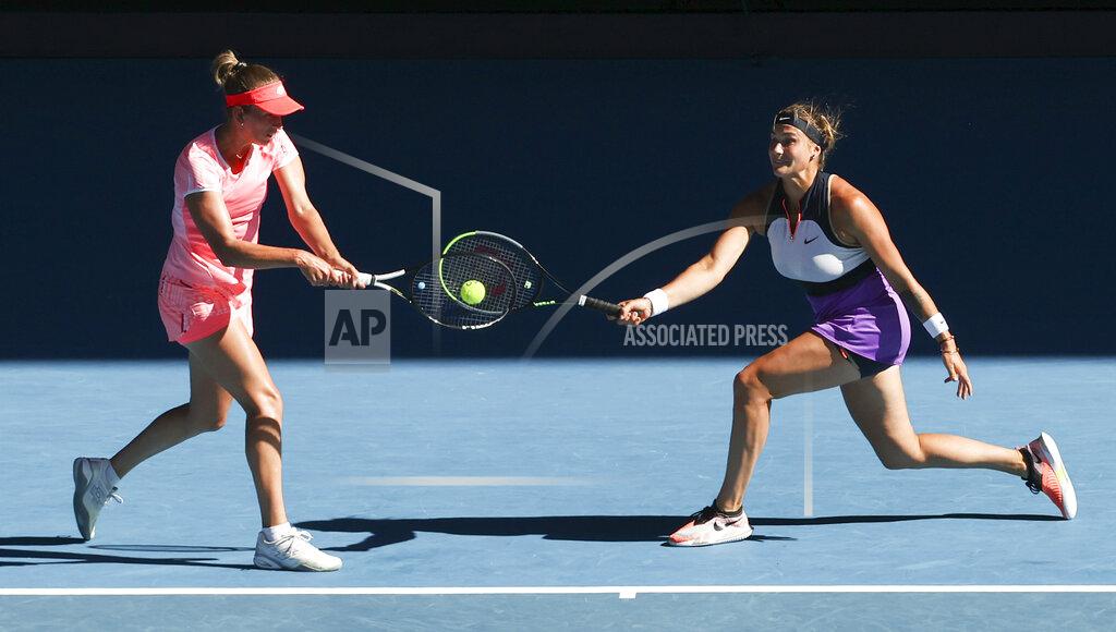 Hamish Blair Belgium's Elise Mertens, left, and Aryna Sabalenka of Belarus play against Barbora Krejcikova and Katerina Siniakova of the Czech Republic during the women's doubles final at the Australian Open tennis championship in Melbourne, Australia, Friday, Feb. 19, 2021.(AP Photo/Hamish Blair)