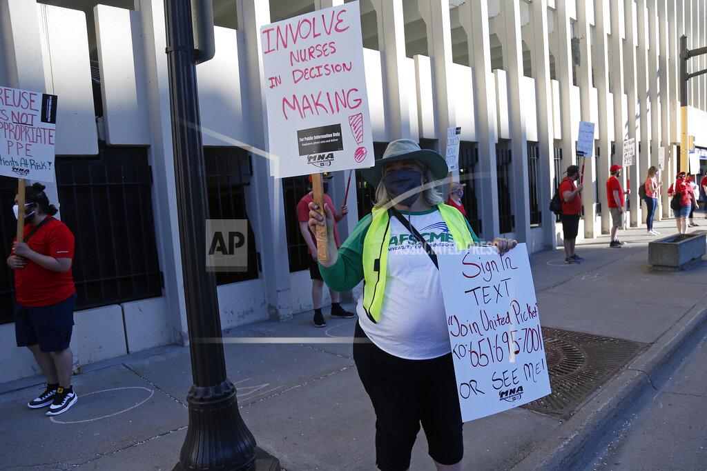 Jim Mone Nurses picket outside United Hospital Wednesday, May 20, 2020 in St. Paul, Minn. as they seek a say in worker protections, increased personal protection resources with higher safety standards, and an end to retaliation against workers who have tried to protect themselves from COVID-19. (AP Photo/Jim Mone)