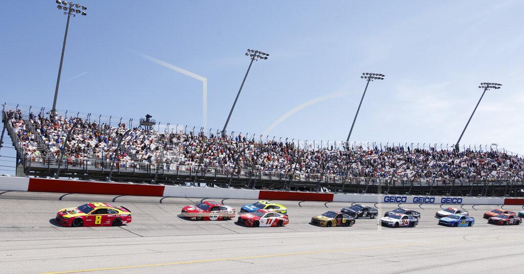 Terry Renna Tyler Reddick (8) leads the field past fans in the Turn 1 grandstands during the NASCAR Cup Series auto race at Darlington Raceway, Sunday, May 9, 2021, in Darlington, S.C. (AP Photo/Terry Renna)