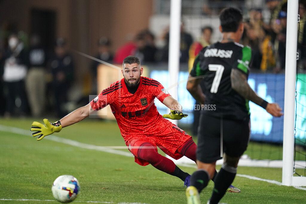 Ashley Landis Los Angeles FC goalkeeper Maxime Crépeau (16) stops a shot by Austin FC forward Sebastián Driussi (7) during the first half of an MLS soccer match in Los Angeles, Wednesday, May 18, 2022. (AP Photo/Ashley Landis)
