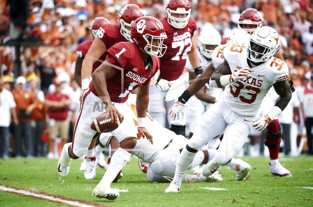 Cooper Neill FILE - In this Oct. 6, 2018, file photo, Oklahoma quarterback Kyler Murray (1) scrambles against Texas during the first half of an NCAA college football game at the Cotton Bowl in Dallas. The Sooners face Texas in the Big 12 championship game on Saturday. (AP Photo/Cooper Neill, FIle)