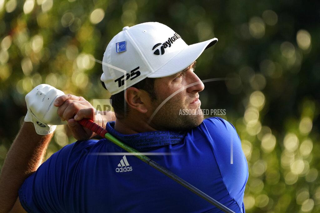 David J. Phillip Jon Rahm, of Spain, watches his tee shot on the 15th hole during the third round of the Masters golf tournament Saturday, Nov. 14, 2020, in Augusta, Ga. (AP Photo/David J. Phillip)