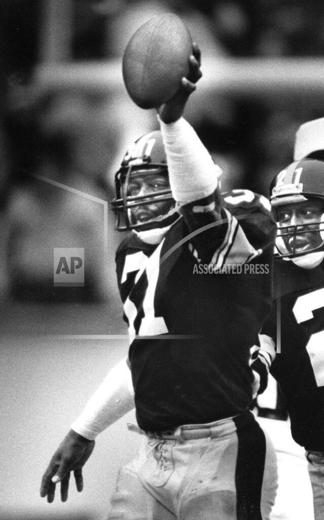 Uncredited FILE - In this Dec. 7, 1986, file photo, Pittsburgh Steelers Donnie Shell holds up his 50th intercepted football pass in the third quarter of an NFL football game against the Detroit Lions in Pittsburgh. The hard-hitting cornerback won four Super Bowls during his 14 years in the NFL and next month will become the fifth — and most unlikely — member of the “Steel Curtain” defense to be enshrined in Canton. (Pittsburgh Post-Gazette via AP, File)