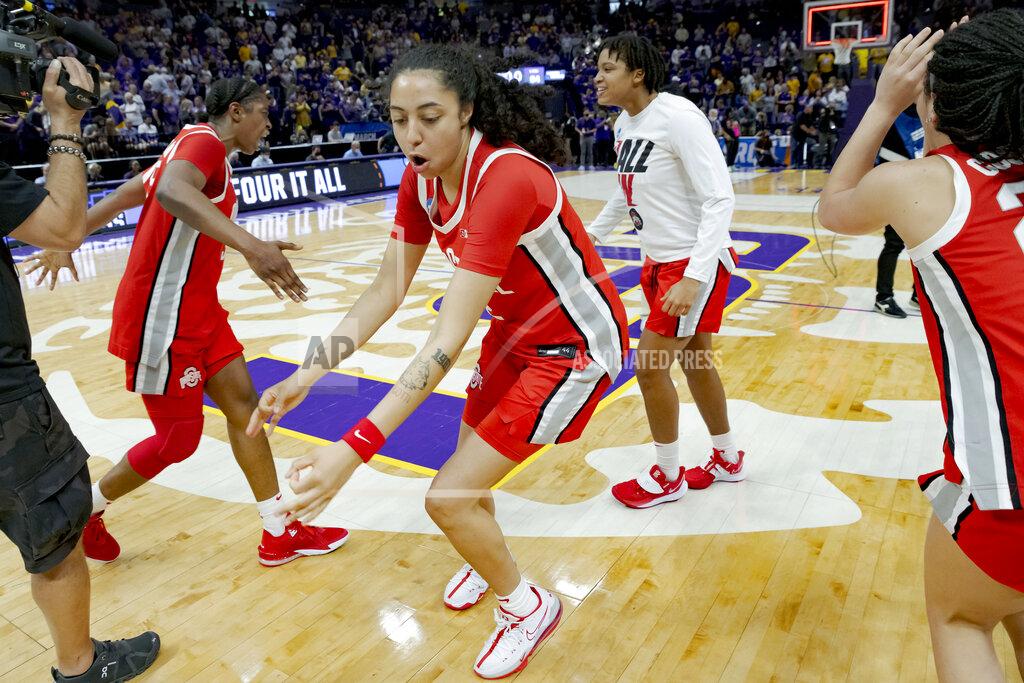 Matthew Hinton Ohio State forward Gabby Hutcherson, center, dances as she and teammates celebrate their victory over LSU in a women's college basketball game in the second round of the NCAA tournament, Monday, March 21, 2022, in Baton Rouge, La. (AP Photo/Matthew Hinton)