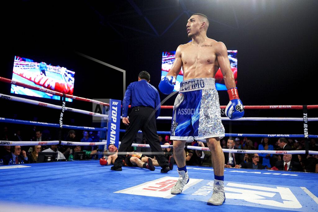 Cooper Neill FILE - In this Feb. 2, 2019, file photo, Teofimo Lopez walks away after defeating Diego Magdaleno during a lightweight boxing match in Frisco, Texas. Vasiliy Lomachenko fights Teofimo Lopez on Saturday, Oct. 17, 2020, in Las Vegas. Boxing fans should be thankful. They’re getting a quality fight _ and they’re getting it for free.(AP Photo/Cooper Neill, File)