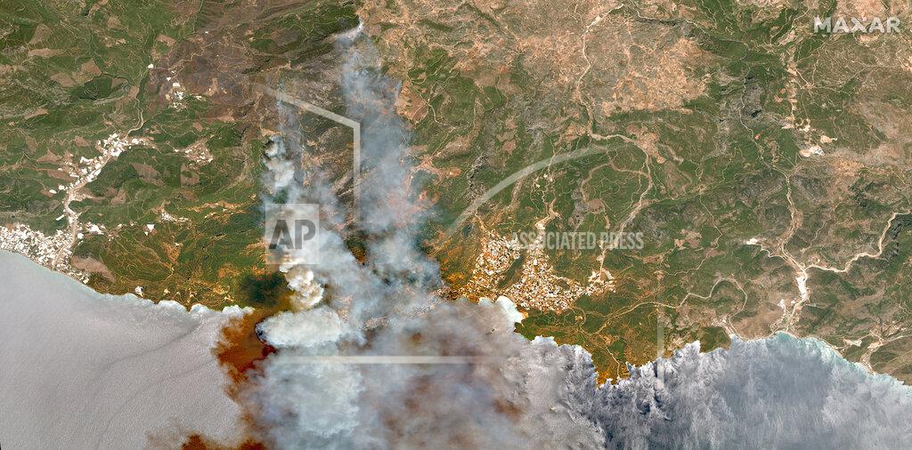 Satellite Image ©2021 Maxar Technologies In this image provided by Maxar, a satellite view of smoke rising from wildfires near Hacibahattin on the southern coast of Turkey, on Thursday July 29, 2021. Turkish fire crews are continuing to fight deadly blazes in southern Turkey that have burned down homes and forced many evacuations. (Satellite image ©2021 Maxar Technologies via AP)