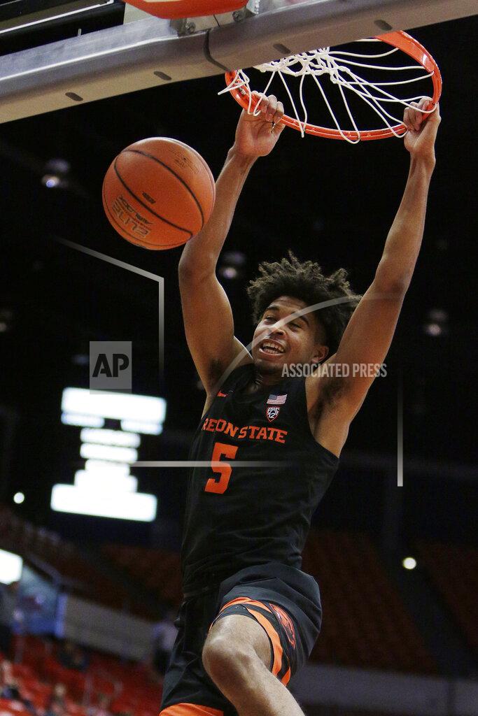 Young Kwak Oregon State guard Ethan Thompson (5) dunks during the first half of an NCAA college basketball game against Washington State in Pullman, Wash., Saturday, March 9, 2019. (AP Photo/Young Kwak)