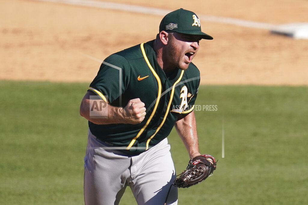 Marcio Jose Sanchez FILE - Oakland Athletics pitcher Liam Hendriks reacts after striking out Houston Astros' Josh Reddick during the eighth inning of Game 3 of a baseball American League Division Series in Los Angeles, in this Wednesday, Oct. 7, 2020, file photo. The Chicago White Sox have finalized a $54 million, three-year deal with Oakland Athletics closer Liam Hendriks, another big move as they set their sights on a championship run. The deal was announced Friday, Jan. 15, 2021. (AP Photo/Marcio Jose Sanchez)