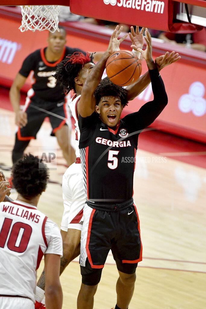 Michael Woods Georgia's Justin Kier (5) drives the hoop against Arkansas during the first half of an NCAA college basketball game Saturday, Jan. 9, 2021, in Fayetteville, Ark. (AP Photo/Michael Woods)