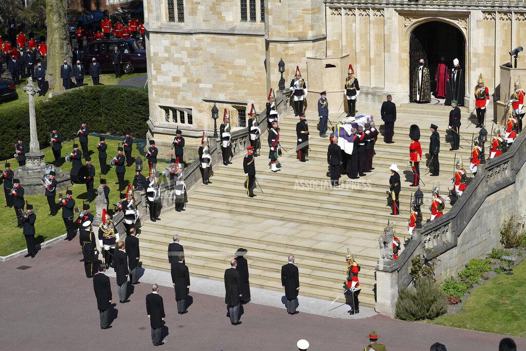 Justin Tallis The coffin arrives at St George's Chapel for the funeral of Britain's Prince Philip inside Windsor Castle in Windsor, England, Saturday, April 17, 2021. Prince Philip died April 9 at the age of 99 after 73 years of marriage to Britain's Queen Elizabeth II. (Justin Tallis/Pool via AP)