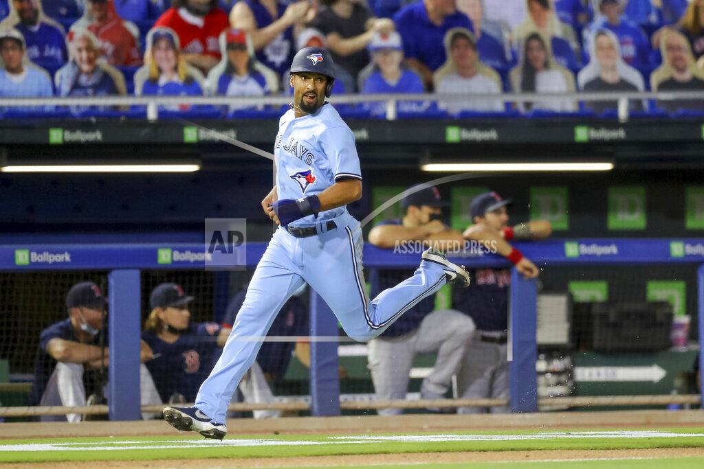 Mike Carlson Toronto Blue Jays' Marcus Semien heads home to score against the Boston Red Sox during the fourth inning of a baseball game Tuesday, May 18, 2021, in Dunedin, Fla. (AP Photo/Mike Carlson)
