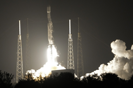 FILE - A SpaceX Falcon 9 rocket, with a payload including two lunar rovers from Japan and the United Arab Emirates, lifts off from Launch Complex 40 at the Cape Canaveral Space Force Station in Cape Canaveral, Fla., on Dec. 11, 2022. But later in April 2023, the spacecraft from a Japanese company apparently crashed while attempting to land on the moon. Japan now hopes to make the world's first &quot;pinpoint landing&quot; on the moon early Saturday, Jan. 20, 2024, joining a modern push for lunar contact with roots in the Cold War-era space race between the United States and the Soviet Union. (AP Photo/John Raoux, File)