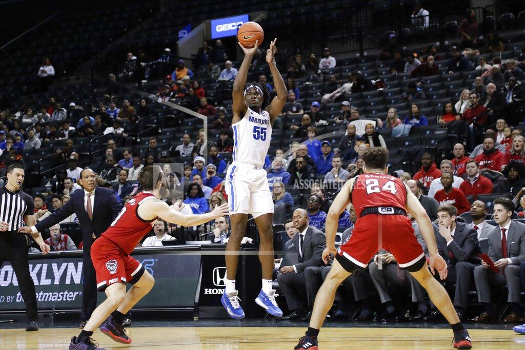 Frank Franklin Ii Memphis' Precious Achiuwa, center, shoots a three-point basket over North Carolina State's Braxton Beverly, left, and Devon Daniels during the first half of an NCAA college basketball game in the Barclays Classic, Thursday, Nov. 28, 2019, in New York. (AP Photo/Frank Franklin II)