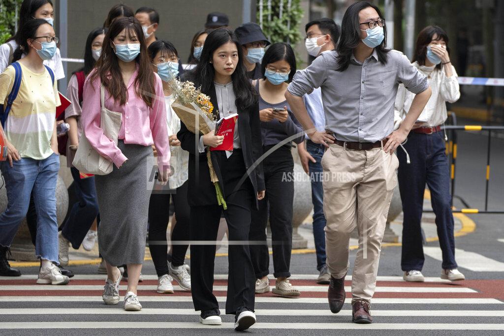 Mark Schiefelbein Zhou Xiaoxuan, center, a former intern at China's state broadcaster CCTV, arrives to attend a court session at a courthouse in Beijing, Tuesday, Sept. 14, 2021. Zhou became the face of the country's MeToo movement after going public with accusations against a prominent CCTV host in 2018. Since then, even as the movement was shut down by authorities, Zhou has continued to speak out. (AP Photo/Mark Schiefelbein)