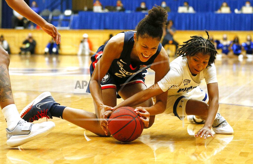 Noah K. Murray Connecticut forward Olivia Nelson-Ododa (20) and Seton Hall guard Lauren Park-Lane (3) vie for the ball during the second half of an NCAA college basketball game on Friday, Dec. 3, 2021, in South Orange, N.J. (AP Photo/Noah K. Murray)