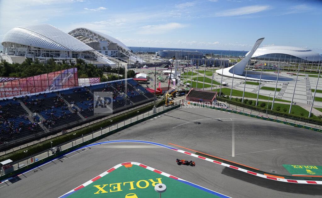 Sergei Grits Red Bull driver Sergio Perez of Mexico steers his cars during the first practice session at the Sochi Autodrom circuit, with the Olympic Park and the Black Sea in the background, in Sochi, Russia, Friday, Sept. 24, 2021. The Russian Formula One Grand Prix will be held on Sunday. (AP Photo/Sergei Grits)