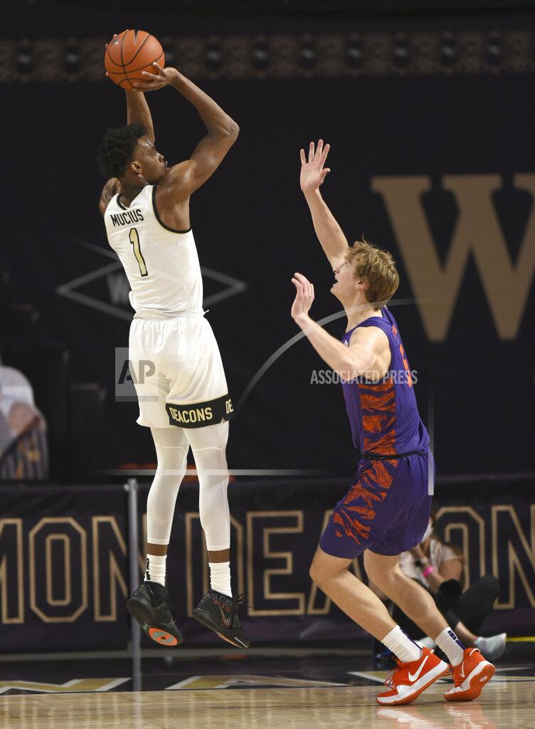 Walt Unks Wake Forest's Isaiah Mucius (1) shoots over Clemson's Hunter Tysonduring the first half of an NCAA college basketball game, Wednesday, Feb. 24, 2021 at Joel Coliseum in Winston-Salem, N.C. (Walt Unks/The Winston-Salem Journal via AP, Pool)