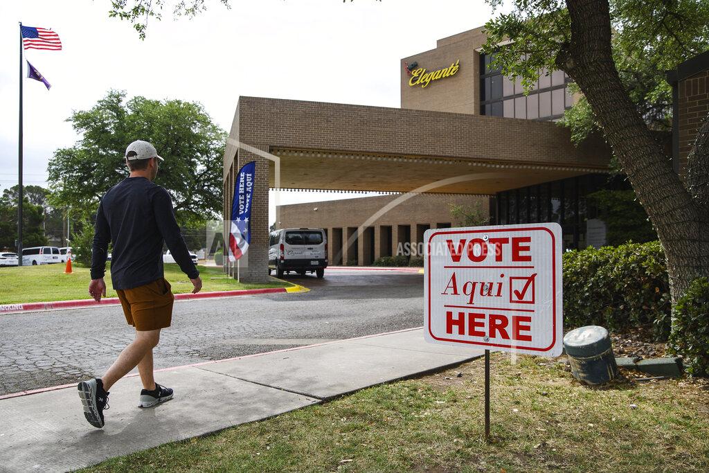 Eli Hartman Voter Austin Hall walks into a polling location to cast his vote in the joint primary runoff election, Tuesday, May 24, 2022, in Odessa, Texas. (Eli Hartman/Odessa American via AP)