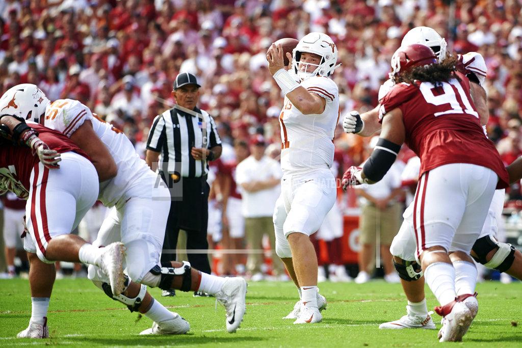 Cooper Neill Texas quarterback Sam Ehlinger (11) drops back to pass against Oklahoma during the first half of an NCAA college football game at the Cotton Bowl, Saturday, Oct. 6, 2018, in Dallas. (AP Photo/Cooper Neill)