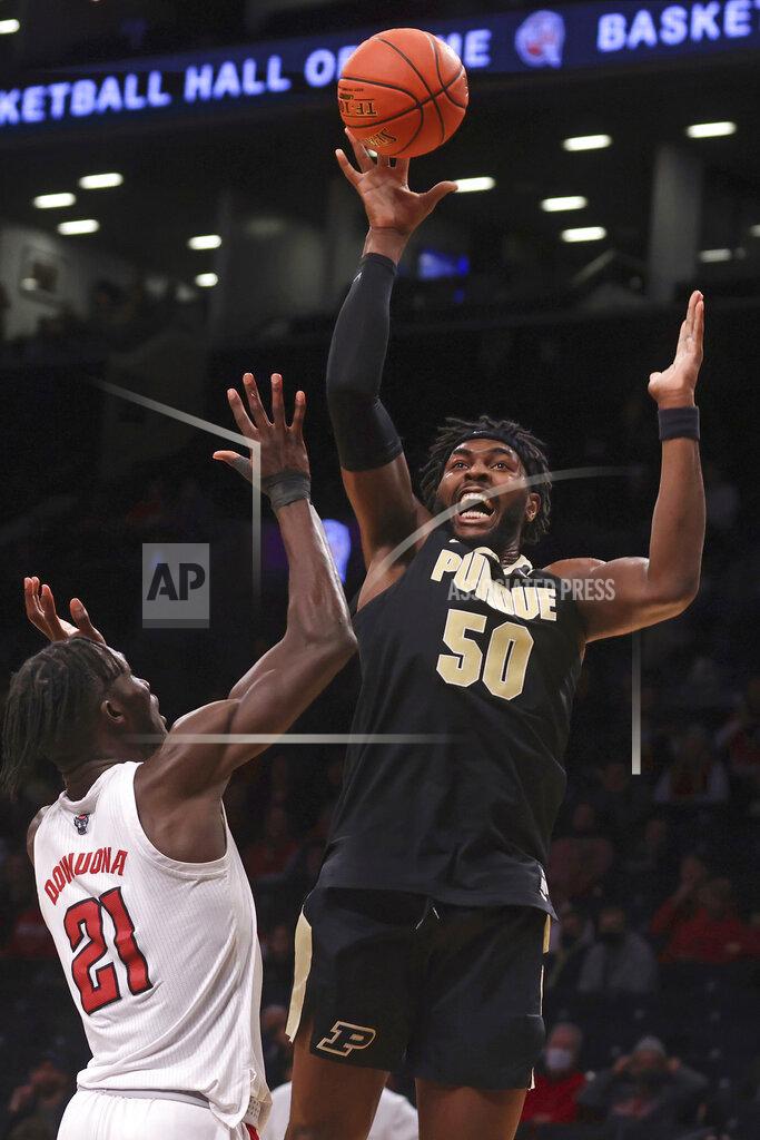 Jason Decrow Purdue's Trevion Williams (50) shoots over North Carolina State's Ebenezer Dowuona (21), of Ghana, during the second half of an NCAA college basketball game Sunday, Dec. 12, 2021, in New York. (AP Photo/Jason DeCrow)