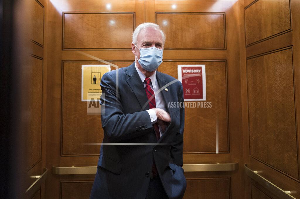 J. Scott Applewhite Sen. Ron Johnson, R-Wis., steps into an elevator as the Senate holds a voting marathon on the Democrats' $1.9 trillion COVID-19 relief bill that's expected to end with the chamber's approval of the measure, at the Capitol in Washington, Friday, March 5, 2021. When the Senate took up the measure on Thursday, Johnson forced an extraordinary half-day holdup on the bill by demanding the chamber's clerks read aloud the entire 628-page measure which took 10 hours and 44 minutes and ended shortly after 2 a.m. (AP Photo/J. Scott Applewhite)
