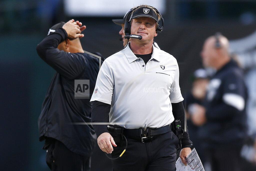 D. Ross Cameron Oakland Raiders head coach Jon Gruden walks on the sideline during the second half of an NFL football game against the Tennessee Titans in Oakland, Calif., Sunday, Dec. 8, 2019. (AP Photo/D. Ross Cameron)