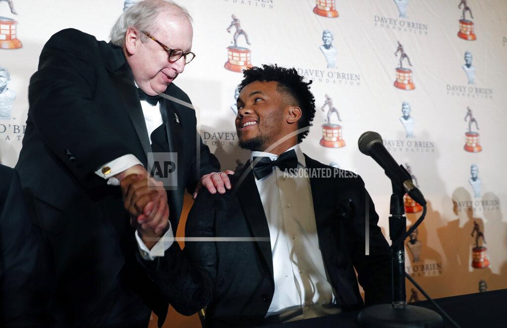 Lm Otero Heisman Trophy winner quarterback Kyler Murray, right, shakes hands with David O'Brien Jr. after the Davey O'Brien football award at a news conference in Fort Worth, Texas, Monday, Feb. 18, 2019. Murray accepted the Davey O'Brien award in his first public appearance since he announced his plan to pursue an NFL career rather than report to spring training as a first-round pick of the Oakland A's. (AP Photo/LM Otero)