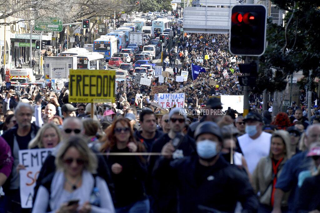 Mick Tsikas Protesters march through the streets during a 'World Wide Rally For Freedom' anti-lockdown rally in Sydney, Saturday, July 24, 2021. (Mick Tsikas/AAP Image via AP)