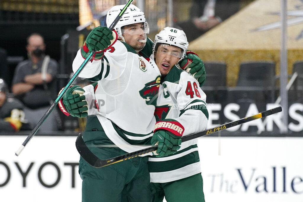 John Locher Minnesota Wild left wing Kevin Fiala, left, celebrates after Minnesota Wild defenseman Jared Spurgeon (46) scored against the Vegas Golden Knights during the third period of an NHL hockey game Thursday, April 1, 2021, in Las Vegas. (AP Photo/John Locher)