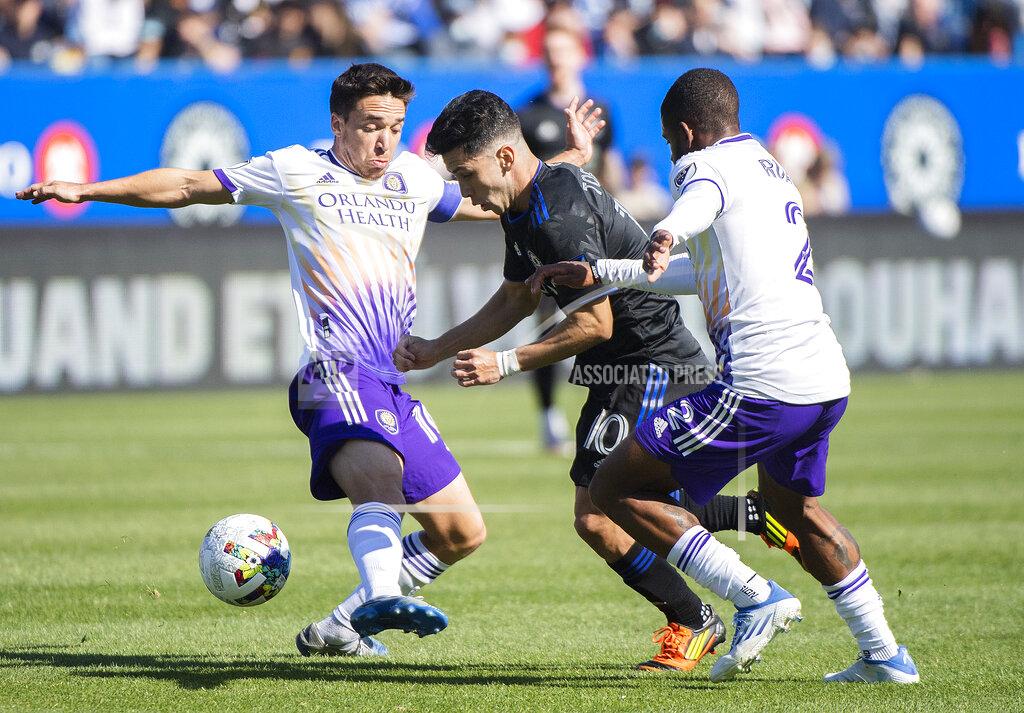 Graham Hughes CF Montreal's Joaquin Torres, center, breaks away from Orlando City's Mauricio Pereyra, left, and Ruan during the first half of an MLS soccer game in Montreal, Saturday, May 7, 2022. (Graham Hughes/The Canadian Press via AP)