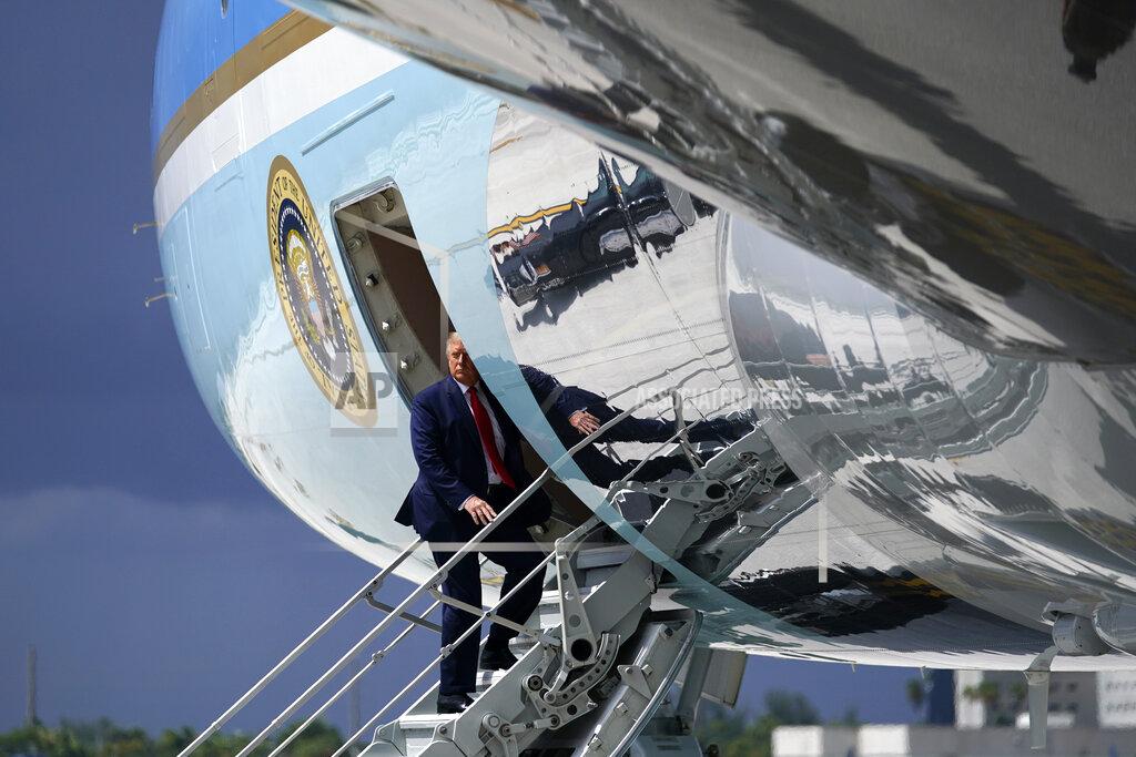 Evan Vucci President Donald Trump pauses as he boards Air Force One at Miami International Airport on Friday, July 10, 2020. (AP Photo/Evan Vucci)