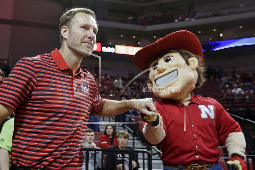Nati Harnik In this Wednesday, Oct. 30, 2019 photo, Nebraska coach Fred Hoiberg is greeted by mascot Herbie Husker, before an NCAA college basketball exhibition game against Doane University in Lincoln, Neb. Hoiberg knows the track record of Nebraska basketball coaches is not good. He wanted the job anyway. He takes over a program that has not won a conference championship in 70 years or ever won a game in the NCAA Tournament. He says a sold-out arena and top-notch facilities can trump the program's lack of tradition. (AP Photo/Nati Harnik)